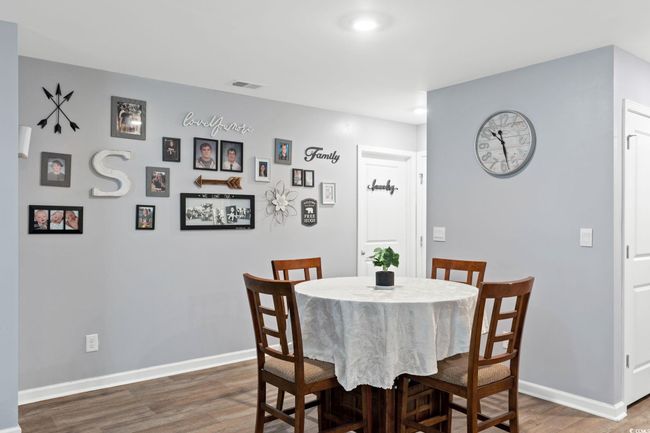 Dining area with dark wood-type flooring | Image 14