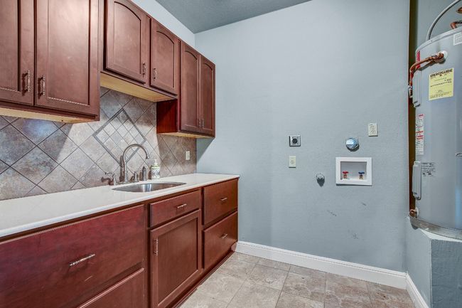 Large laundry with another storge closet | Image 15
