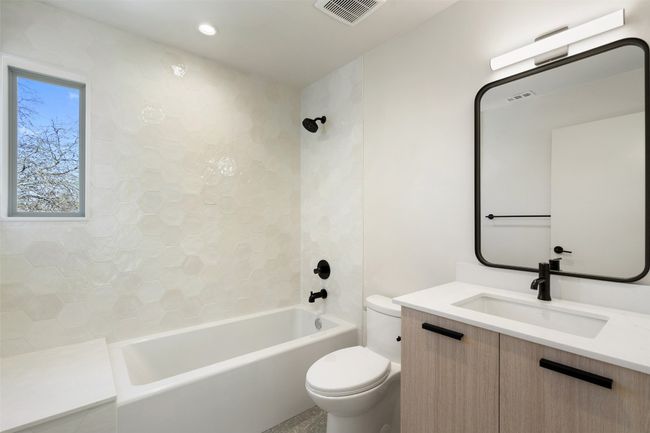 Full bath featuring toilet, shower / bathtub combination, visible vents, and vanity | Image 14