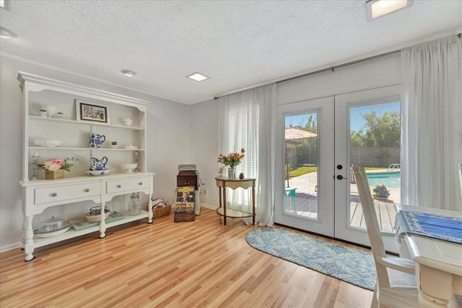 Another view shows there is additional room just off the family room. The seller is using this space for a beautiful hutch to showcase their favorite pieces. | Image 15