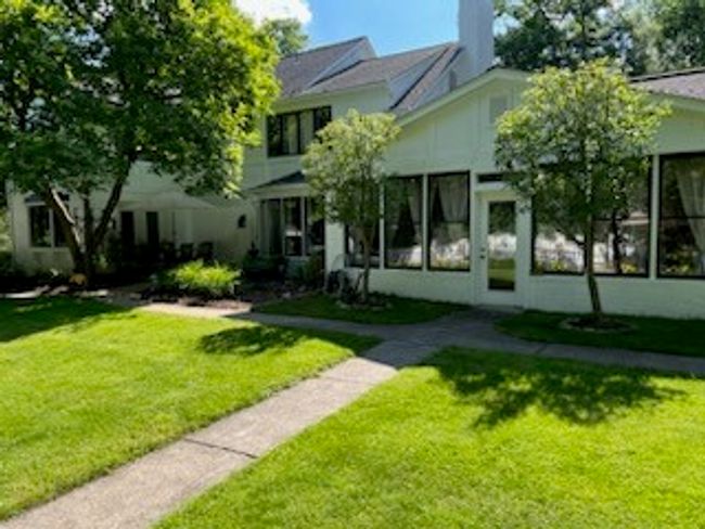 Rear of home, showing the short path to the pool | Image 36