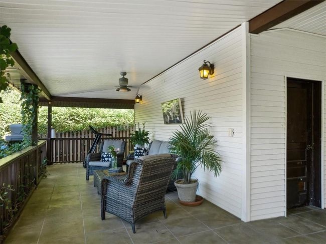 View of patio featuring outdoor lounge area and ceiling fan | Image 27