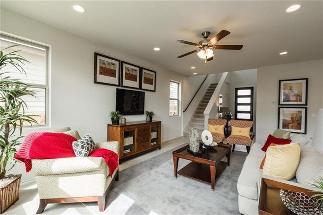 Living area featuring stairs, recessed lighting, a ceiling fan, and light carpet | Image 16