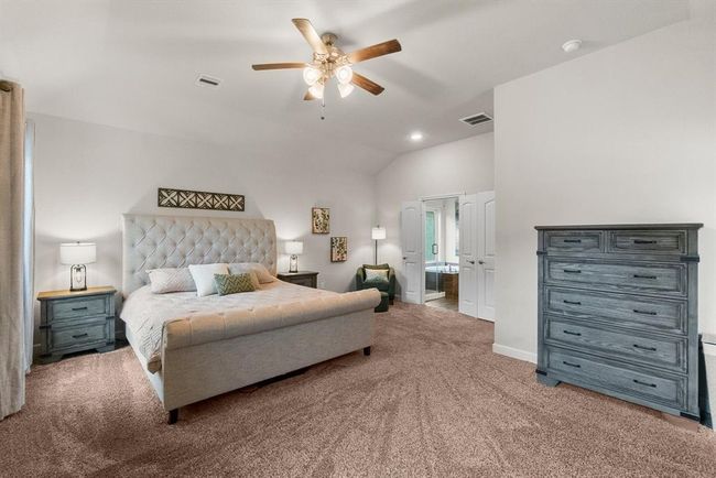 Primary retreat offers ultimate relaxation and private access to back patio. | Image 15