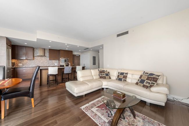 Living room with dark wood-style floors | Image 7