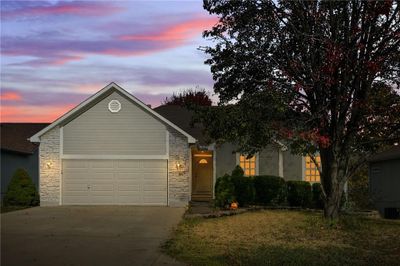 View of front of property with a garage | Image 1