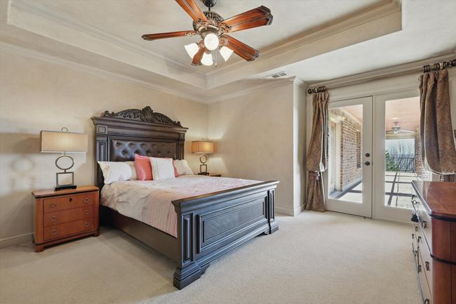 This top floor bedroom has a Juliet balcony and direct access to the patio | Image 28