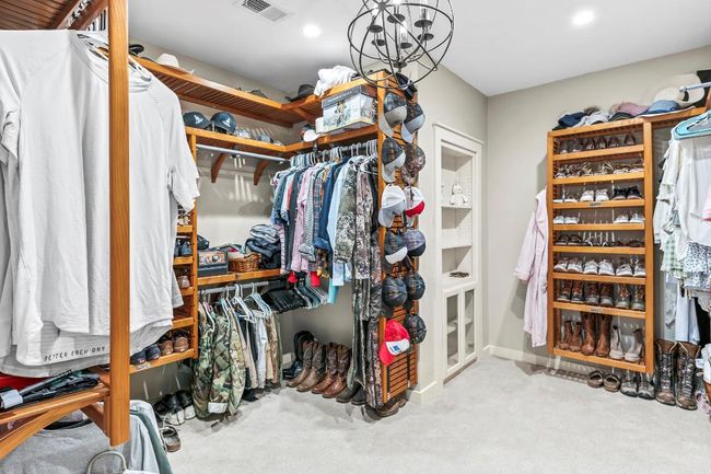 Walk in closet with carpet flooring | Image 18