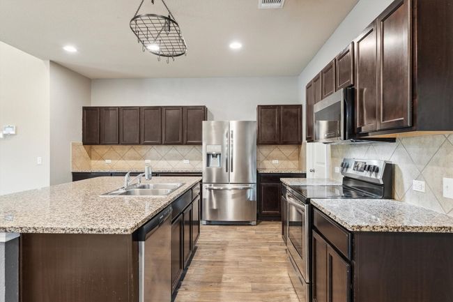 1008 Comal Run, House other with 4 bedrooms, 3 bathrooms and 4 parking in Hutto TX | Image 7