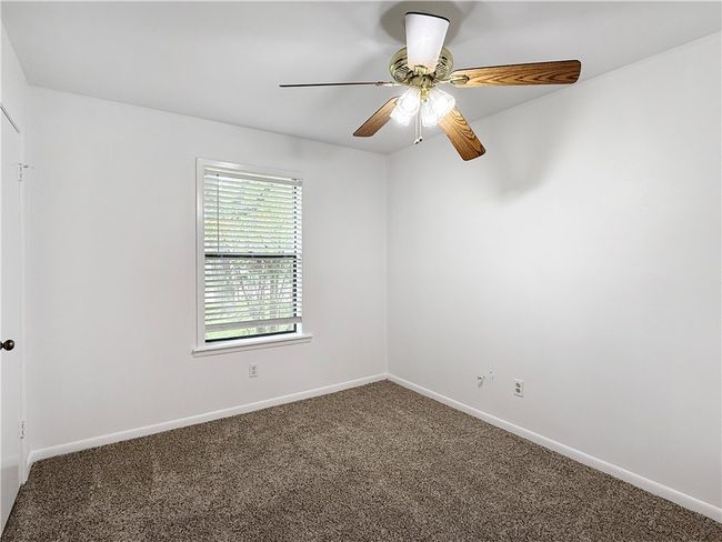 Spare room with carpet and a ceiling fan | Image 16