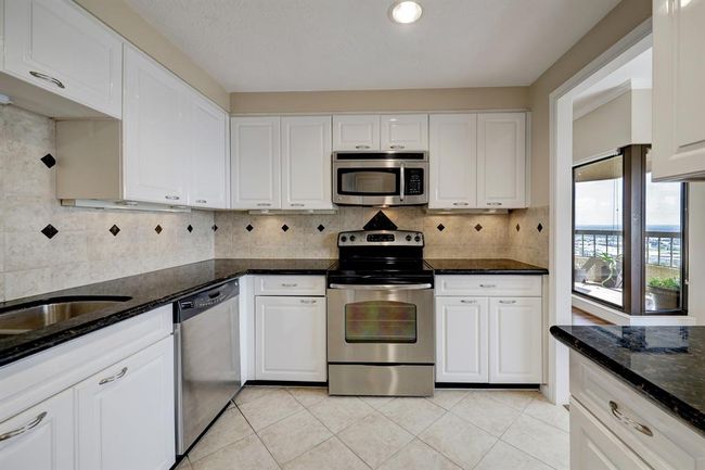 Updated kitchen is adjacent to the breakfast room | Image 4