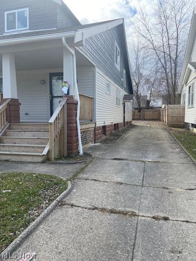 View of side of home with covered porch | Image 2