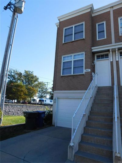 View of front facade with a garage | Image 1