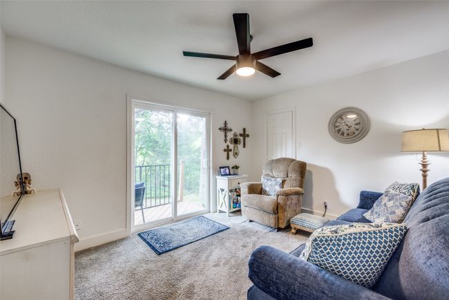 Living room featuring ceiling fan, carpet floors, and baseboards | Image 20