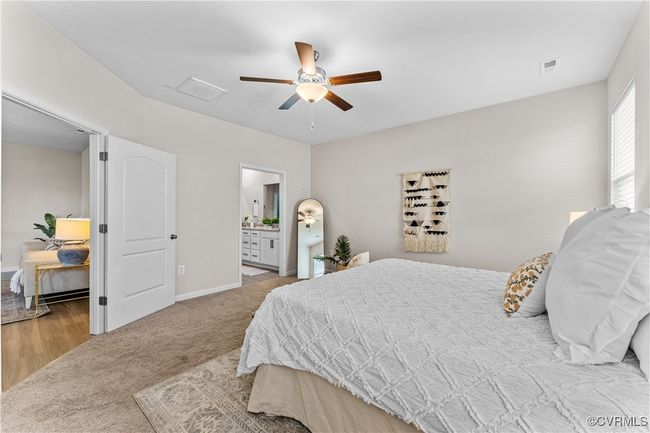 Bedroom with carpet flooring, baseboards, and ceiling fan | Image 30