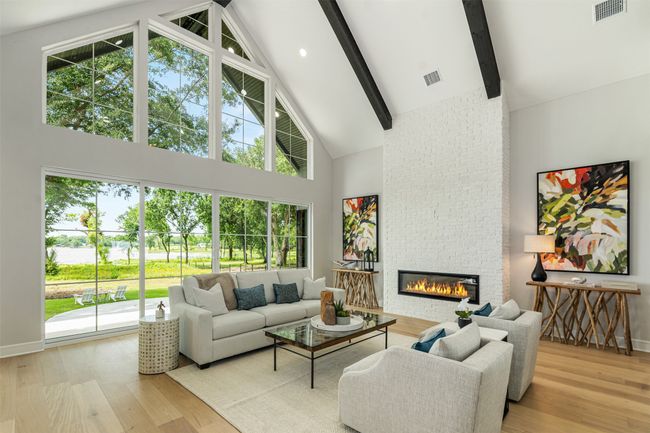 Lake views, fireplace, hardwoods, 17+ ceiling heights, double sliding doors leading to your outdoor oasis | Image 6