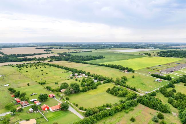 Aerial view of sparsely populated area with abundant farmland | Image 17