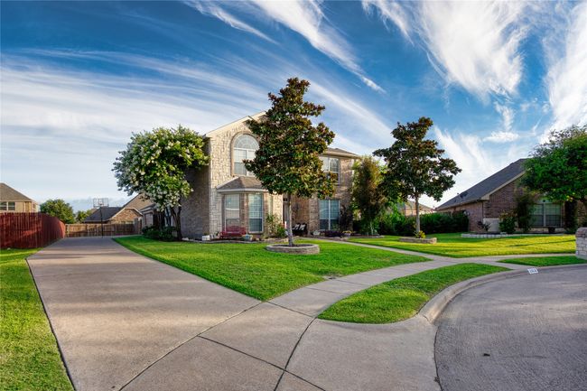 View of property hidden behind natural elements with stone siding | Image 33