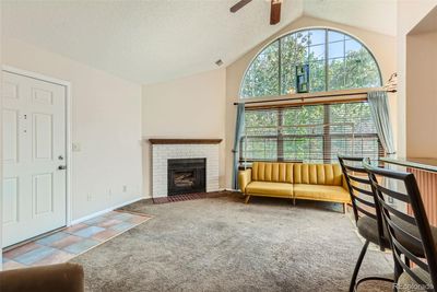 Living room with fireplace & lots of natural lighting. | Image 3