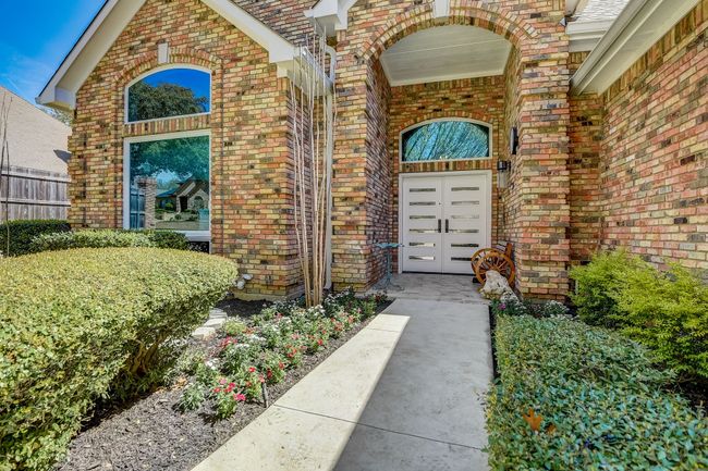 Front view of home featuring energy efficient blue glass throughout the home | Image 39