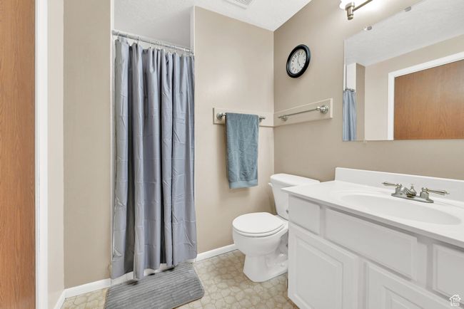 Bathroom with walk in shower, vanity, and toilet | Image 30