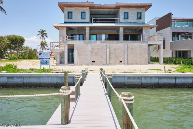 Dock area with a water view and a balcony | Image 10