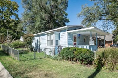 View of home's exterior with a lawn and covered porch | Image 2