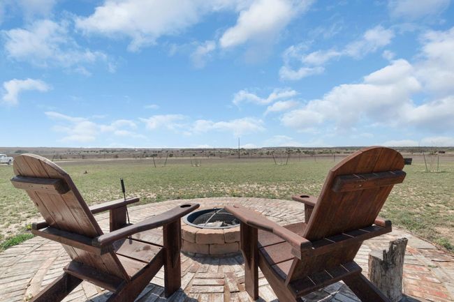 View of patio / terrace featuring a rural view and an outdoor fire pit | Image 5