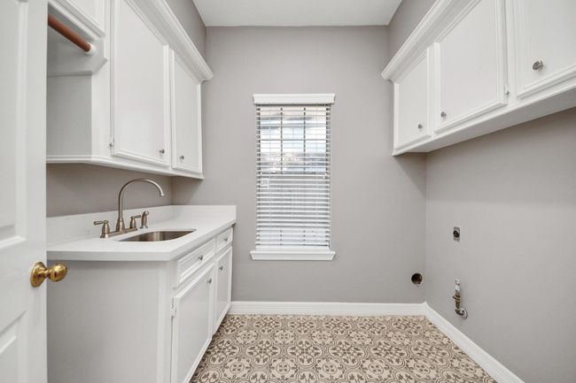 Laundry room with sink. You can have gas or electric dryer. | Image 16