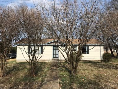 View of side of property featuring a lawn | Image 1