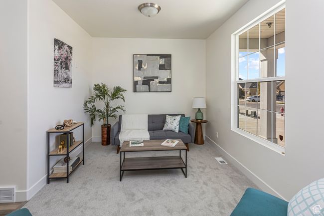 Sitting room featuring baseboards, visible vents, and carpet | Image 4