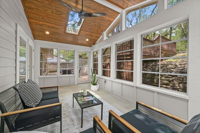 This tranquil retreat brings the outdoors in for year-round enjoyment. | Image 17