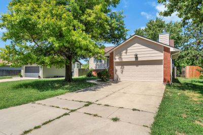 View of front of house with a garage and a front yard | Image 2