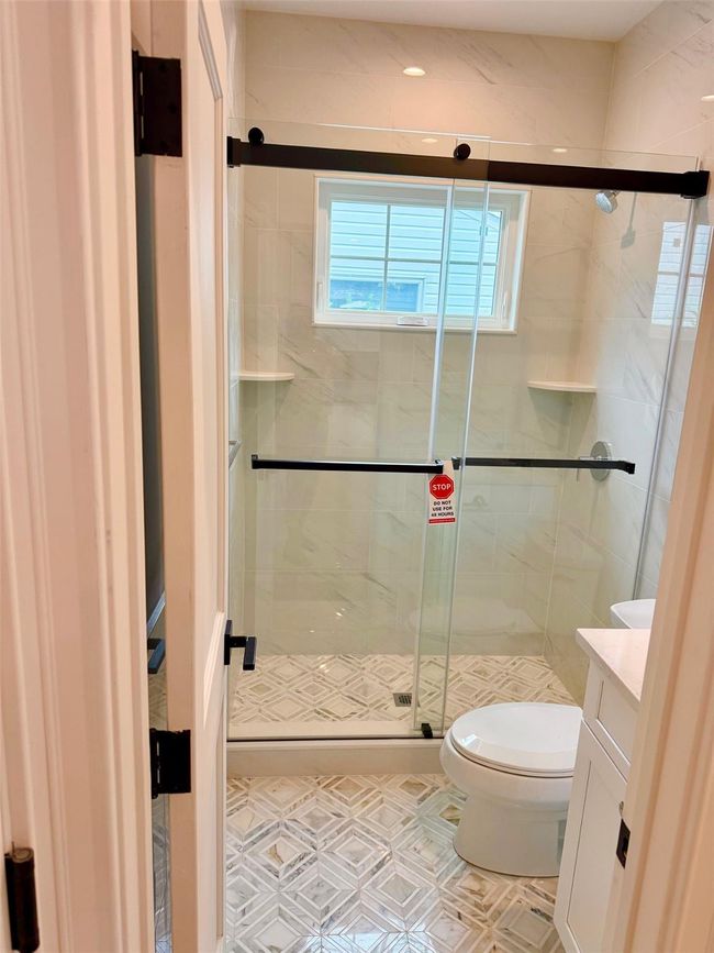 Bathroom with vanity and a stall shower | Image 7