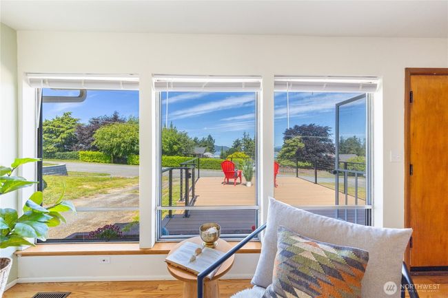 Large windows offer an abundance of light as you take it all in. | Image 6