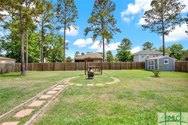 Large 1/3 acre privacy fenced with storage building | Image 38