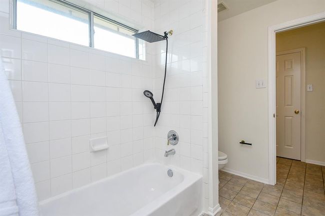 Your secondary bathroom is also complete with a shower/tub combo. Note that your home comes with top-of-the-line Navien tankless gas water system that saves energy and never runs out of hot water for your whole family! | Image 29