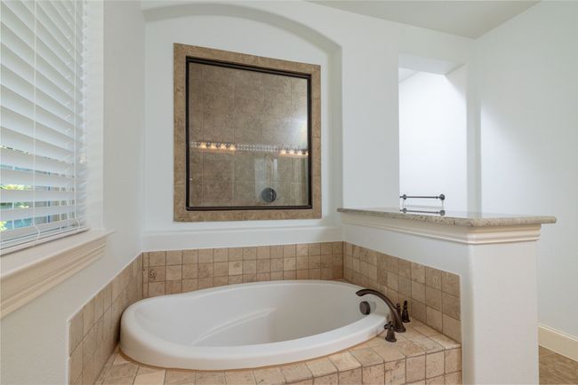 Separate Tile Shower Behind Glass Above Tub | Image 23