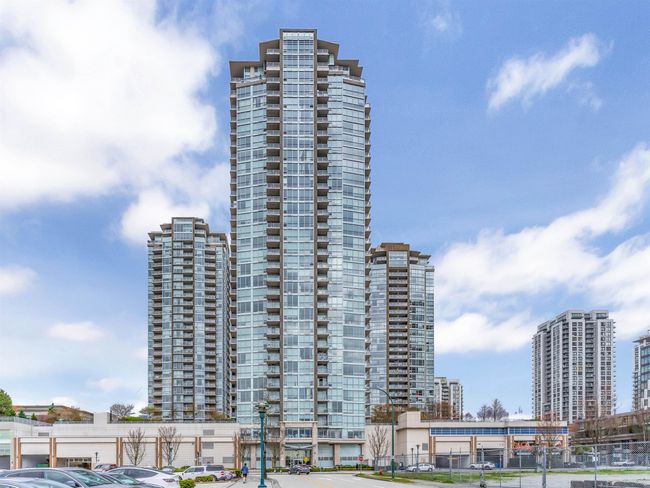 View of building exterior with a view of city and uncovered parking | Image 18