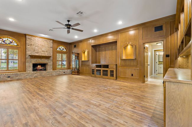 Huge Den with brick fireplace, built-in bookcases, & cedar closet | Image 17