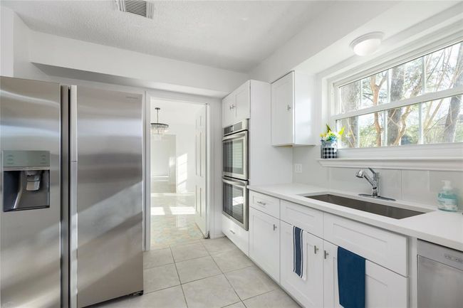 A view from the kitchen looking into the formal dining and butlers door | Image 19