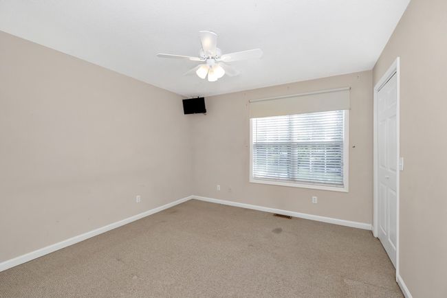 Master bedroom- carpet, ceiling fan | Image 11