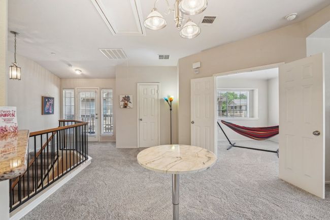 Split-Level Style – Upstairs living offers privacy and quiet away from the entry. | Image 6