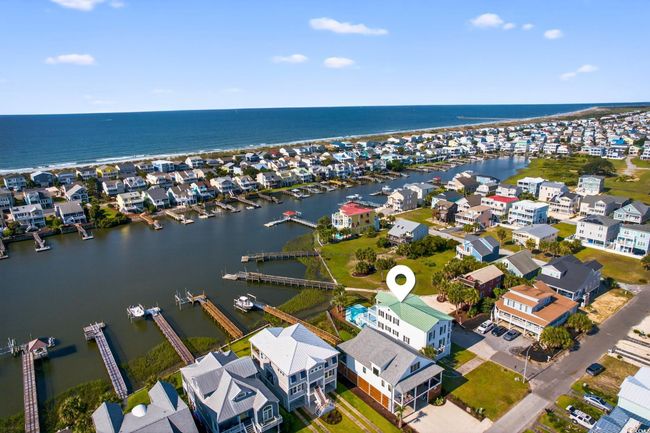 Aerial view of residential area featuring a large body of water | Image 39