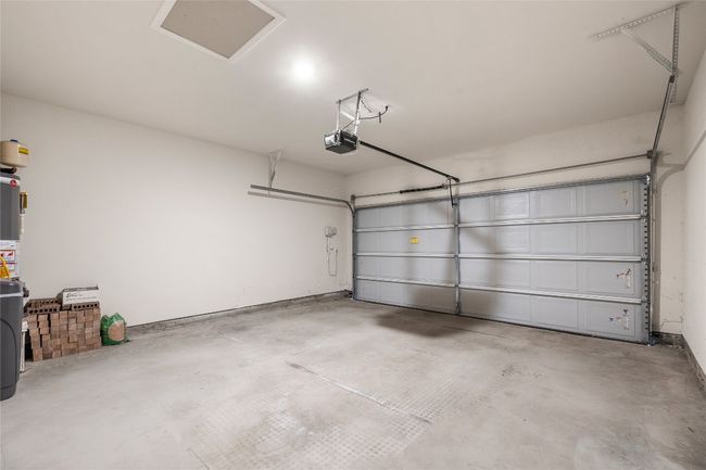 Garage with a garage door opener | Image 10