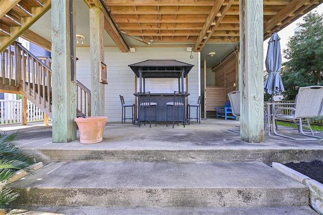 Enjoy your own private oasis with this charming Tiki Bar, perfect for entertaining and relaxation in your backyard retreat. | Image 29