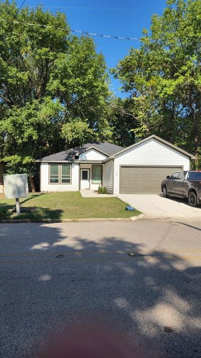 Single story home with a front yard | Image 1