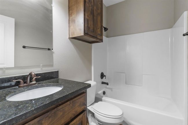 Full bathroom featuring vanity and shower combination | Image 12
