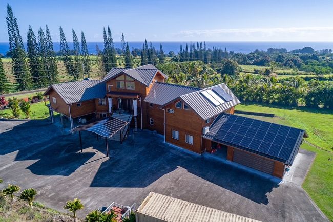 Three car enclosed garages plus a 20 X 20 ohana shades Carport with car charger. See the 28 owned photovoltaic Pannels on the roof for very low electric bill | Image 22