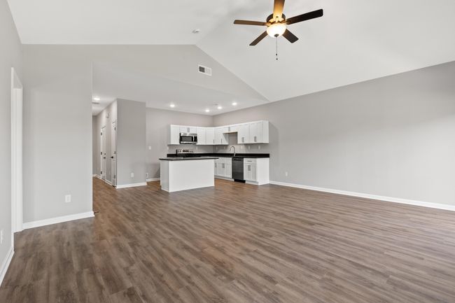 View of living room/kitchen from back of home | Image 13